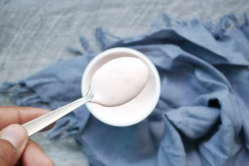 Spoonful of plain yogurt, a popular lick mat topping for dogs