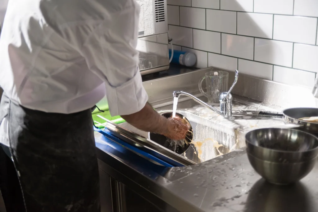 Washing stainless steel bowls in a kitchen sink