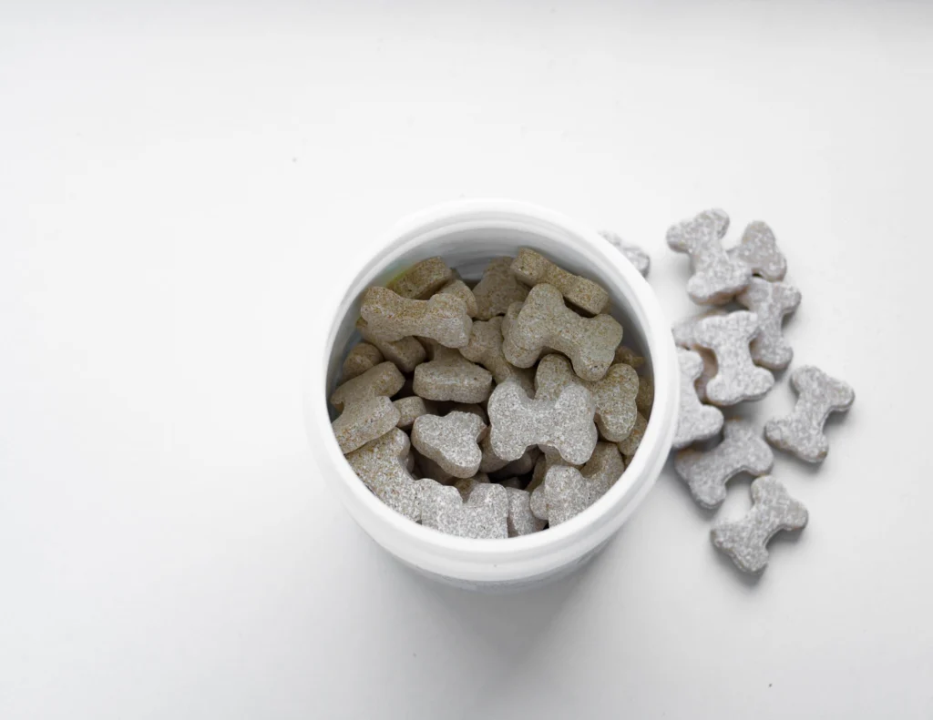 White jar of bone-shaped dog biscuits